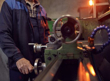 Man working on lathe